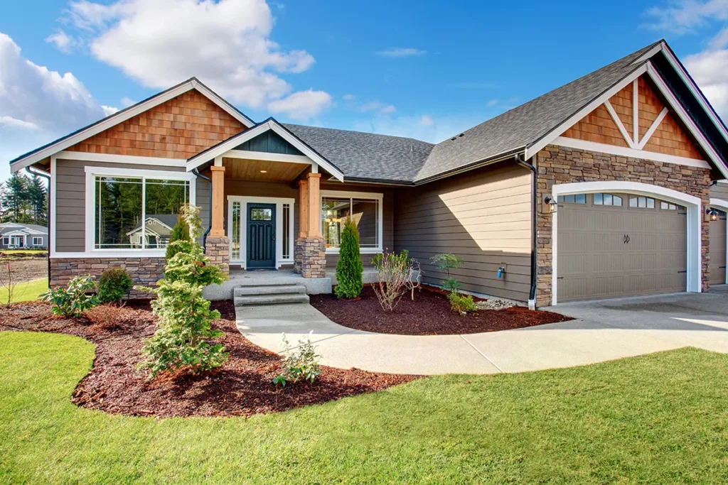 The exterior of a house with wooden accents and a spacious front lawn, showing the concept of how an outdated electrical system decreases property value.